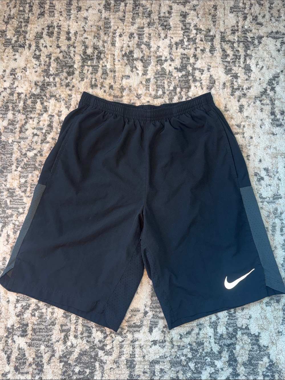 Nike Black Athletic Shorts with White Swoosh and Gray Side Panels
